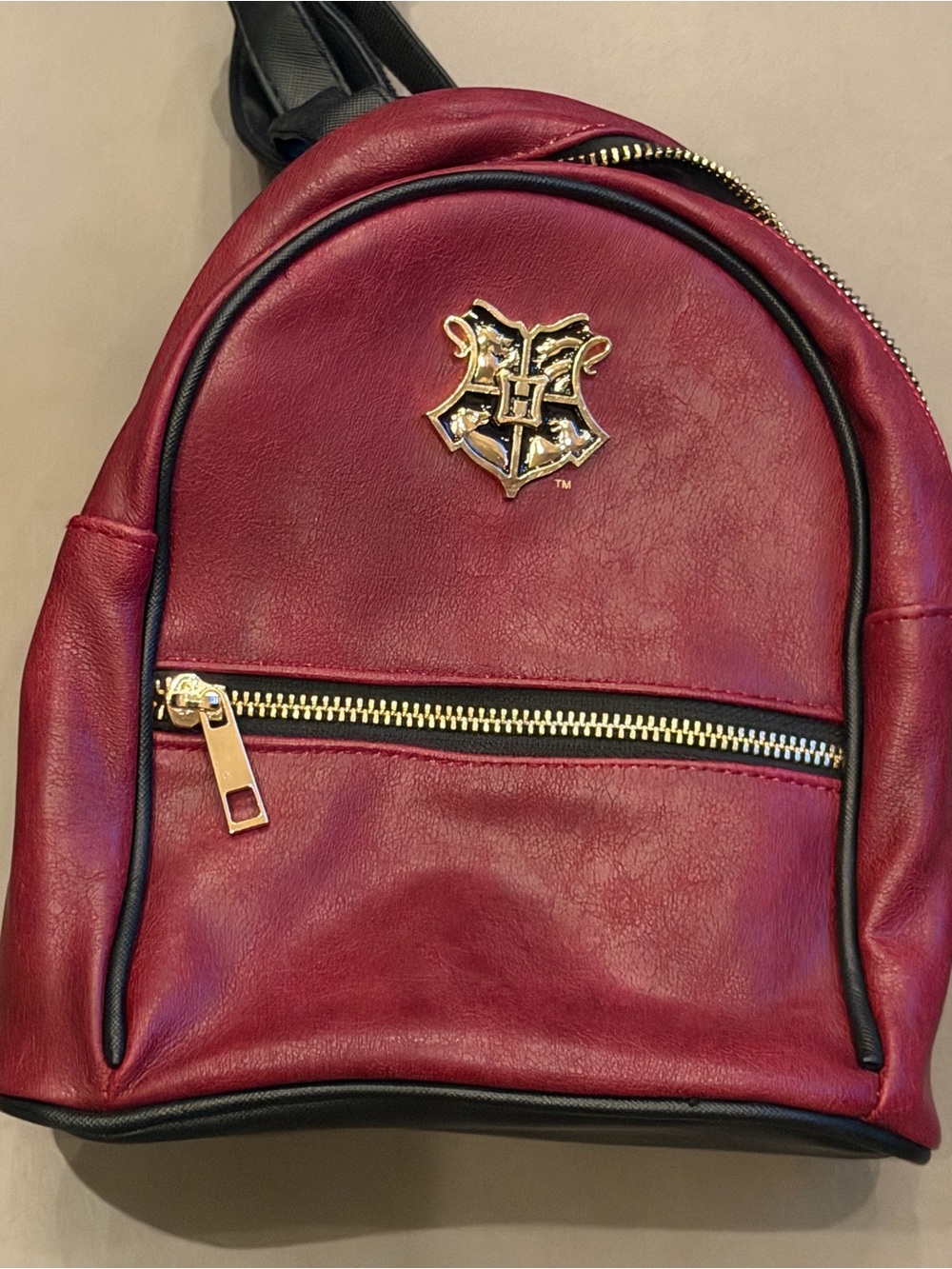 Warner Bros. Deep Burgundy Mini Backpack with Gold Crest.. Harry Potter